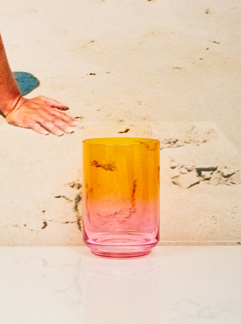 A single Acapulco gradient glass of tangerine to pink gradient.
